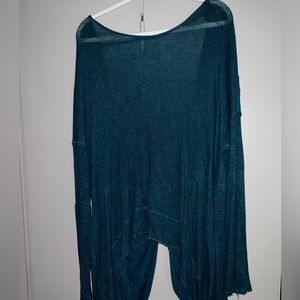 Free people open back sweater in a teal/emerald color